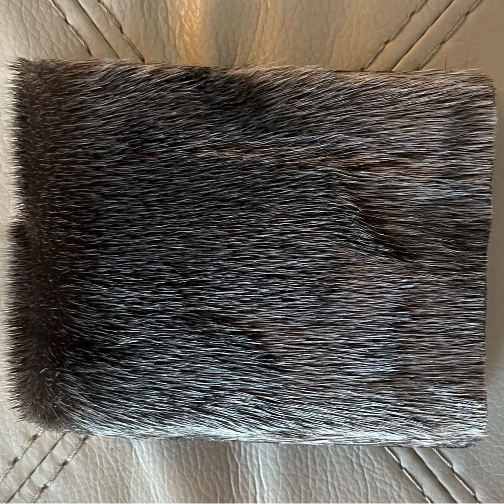 Authentic Seal fur wallet. Multiple card slots. Zippered cash area.